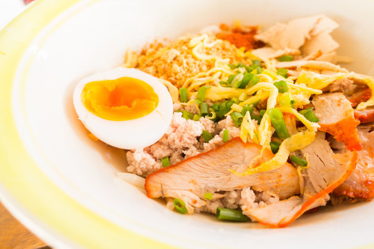 Asian red pork noodle with egg soup