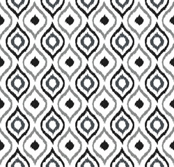 Seamless background image of hand drawn grey tone round curve kaleidoscope pattern.
