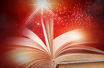 Abstract red magic book on wooden background