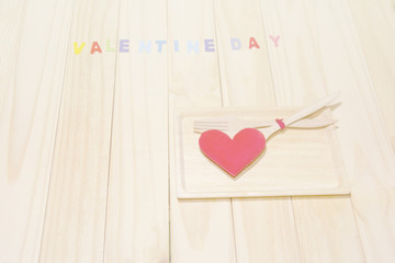With Heart concept valentine on Wood dish and wood background.