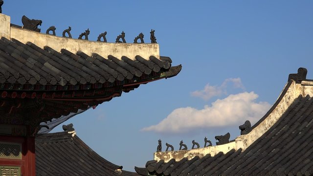Traditional Korean Japsang Guardian Figures on the roof of pavilions in the Gyeongbokgung Palace. Seoul, South Korea