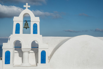 A bell tower at a Greek Orthodox church in Oia town on the island of Santorini, Greece