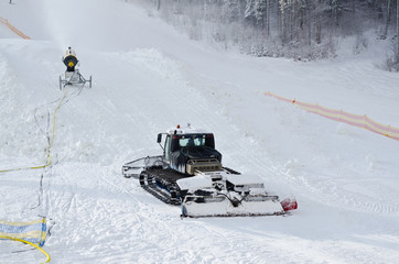 Crawler Tractor gun and throwing snow