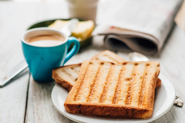 Breakfast with coffee, toasts, butter and jam