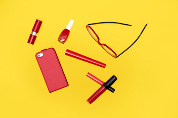 Set of red cosmetics with red glasses