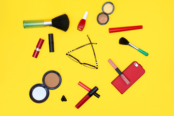 Set of red cosmetics with glasses