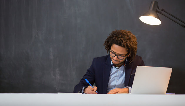 Friendly charismatic hip young African American businessman in a