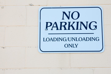 No Parking sign, loading and unloading only