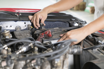 Close-Up hand of Mechanic checking car battery