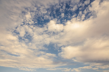 Fototapeta premium Cumulus whithe clouds in the blue sky at sunset