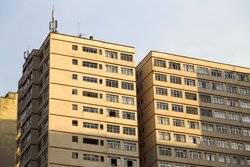 The light of Sunset reflected in an old building on Avenida Paul