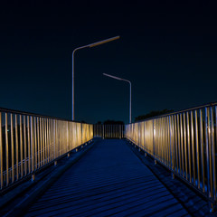 Footbridge with light reflection at night