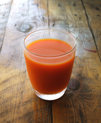 orange juice on rustic wood