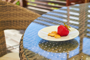 Strawberry dessert on a table on the terrace