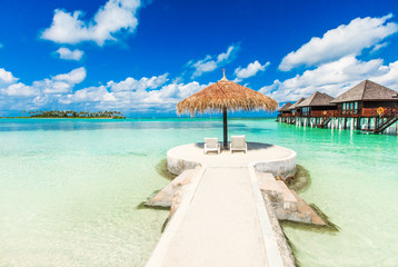  beach with water bungalows Maldives