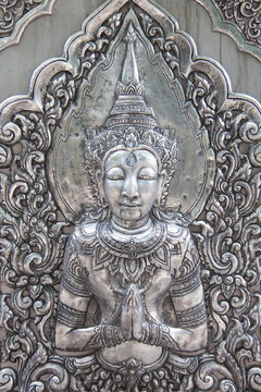 Thai style silver carving art on temple wall