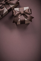 Christmas gift boxes on brown background holidays concept