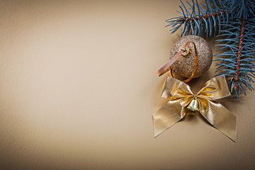 Christmas golden ball bow pine branch holidays concept