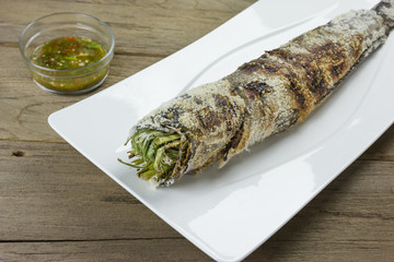 grill striped snakehead fish with salt coated