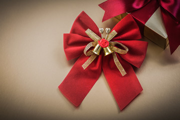 Packed present box bow on golden background holidays concept