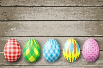 Colorful easter eggs  on wood background. Vector illustration.