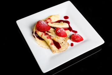 Pancake with strawberry sauce.