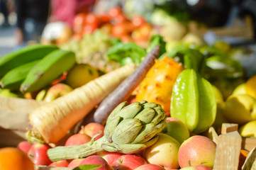 Mixed fruits and vegetables on market stall