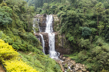 Fototapeta na wymiar Waterfall and hills in the Hill Country next to Nuwara Eliya in central Sri Lanka, Asia