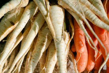 Outdoor farmers market stand with various vegetables for sale