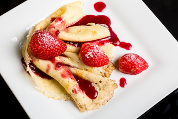 Pancake with strawberry sauce.