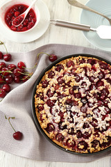 Tasty homemade pie with cherries on table close up