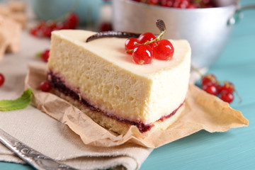 Tasty cheesecake with berries on table close up