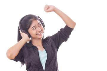 Portrait of young woman with headphones listening music. 