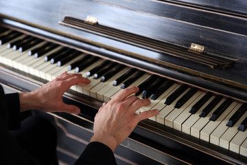 Close up of man hands classic piano playing