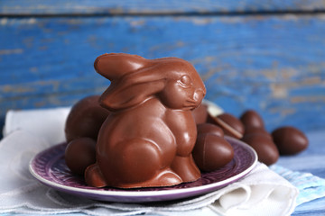 Easter chocolate bunny and eggs on wooden background