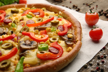 Delicious sliced pizza with vegetables, close-up