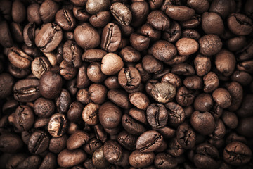 Closeup background with dark roasted coffee beans