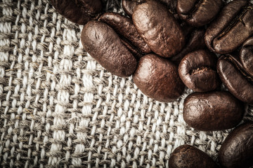 Coffee beans on a light napkin for background. Space for text. T