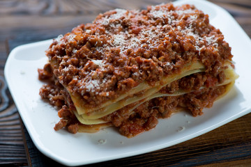 Closeup of lasagna bolognese, selective focus, studio shot