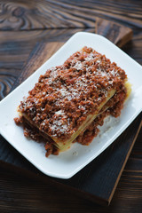Homemade meat and cheese lasagna, high angle view, closeup