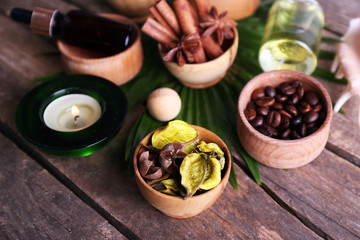Beautiful spa setting on palm leaf on wooden table
