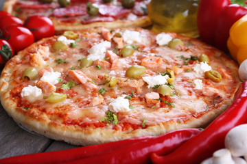 Delicious tasty pizza with ingredients, closeup