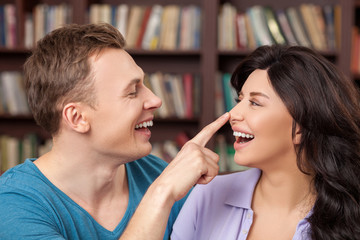 Attractive boyfriend and girlfriend are making fun