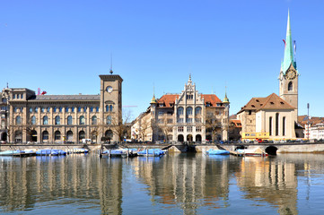 Obraz na płótnie Canvas Historical monuments of Zurich reflected in water, Switzerland.