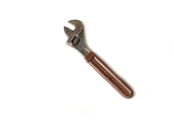 Old rusty wrench, isolated on white background.