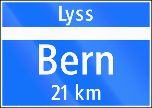 Road sign used in Switzerland - End of town (with distance to other town) on major road