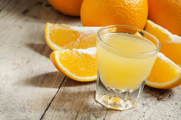 Orange juice in a large glass, selective focus