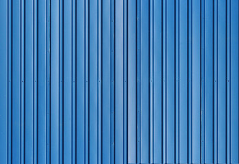 Obraz premium Blue metal corrugated fence with vertical bars