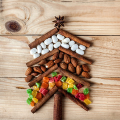 Christmas card with natural decorations on wooden background