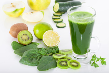 Green smoothie from spinach, kiwi, apple and cucumber, white background 